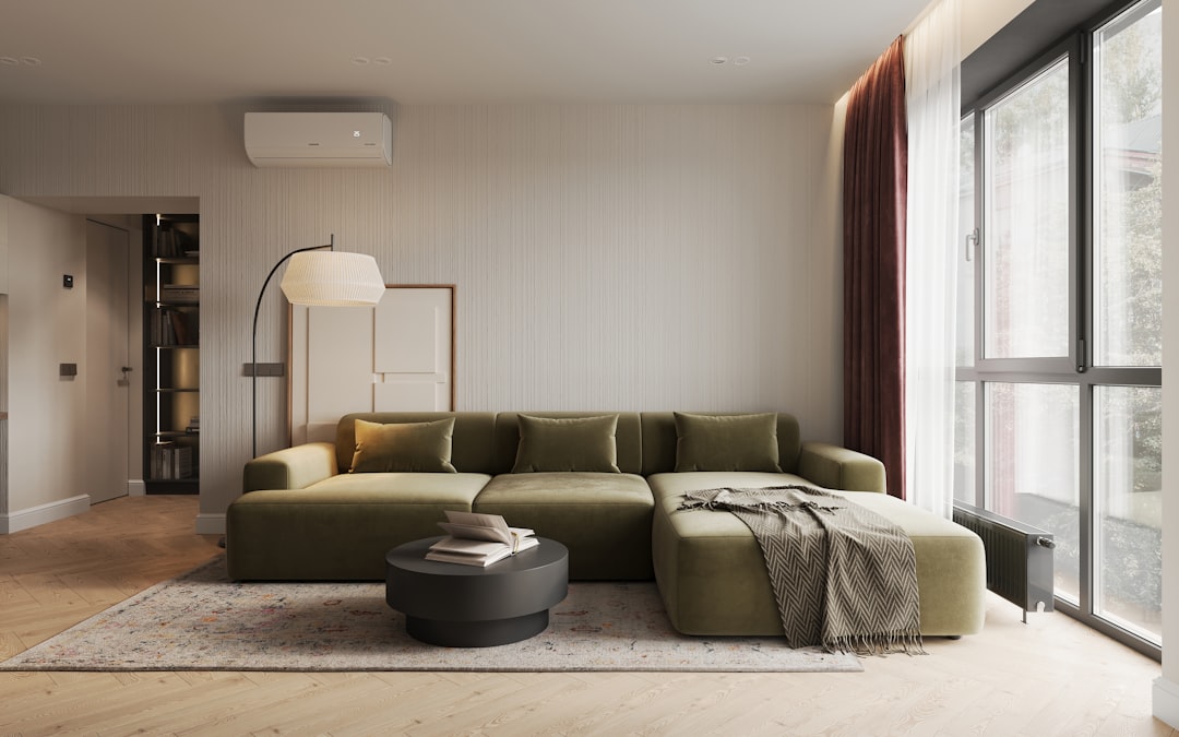 A cozy minimalist living room with warm lighting, soft textures, and personal decor elements that create an inviting atmosphere.